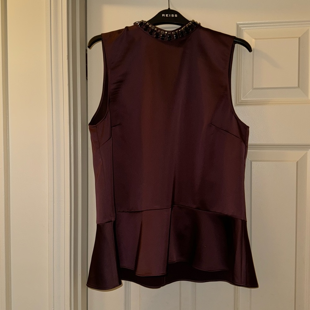 Burgundy pendulum blouse with bead work.